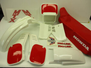 Restauratieset (incl. koplampspoiler wit/rood) - Kleur: Shasta White (NH138)